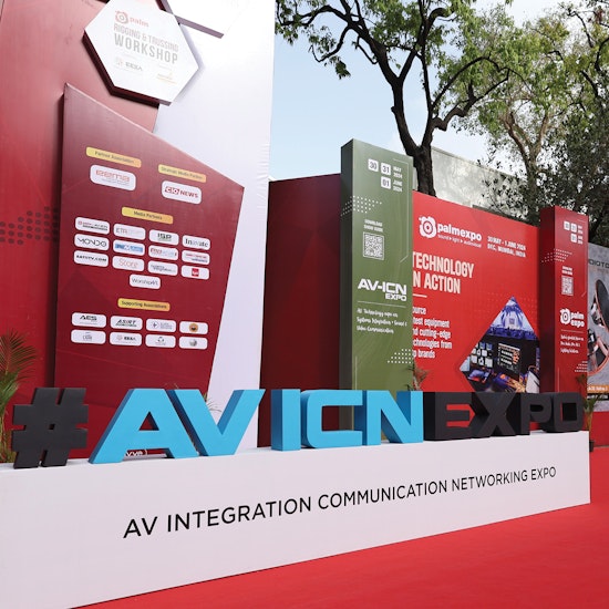 AV ICN Expo entrance display with large branded signage, sponsor logos, and promotional banners for audiovisual integration and communication networking technology event