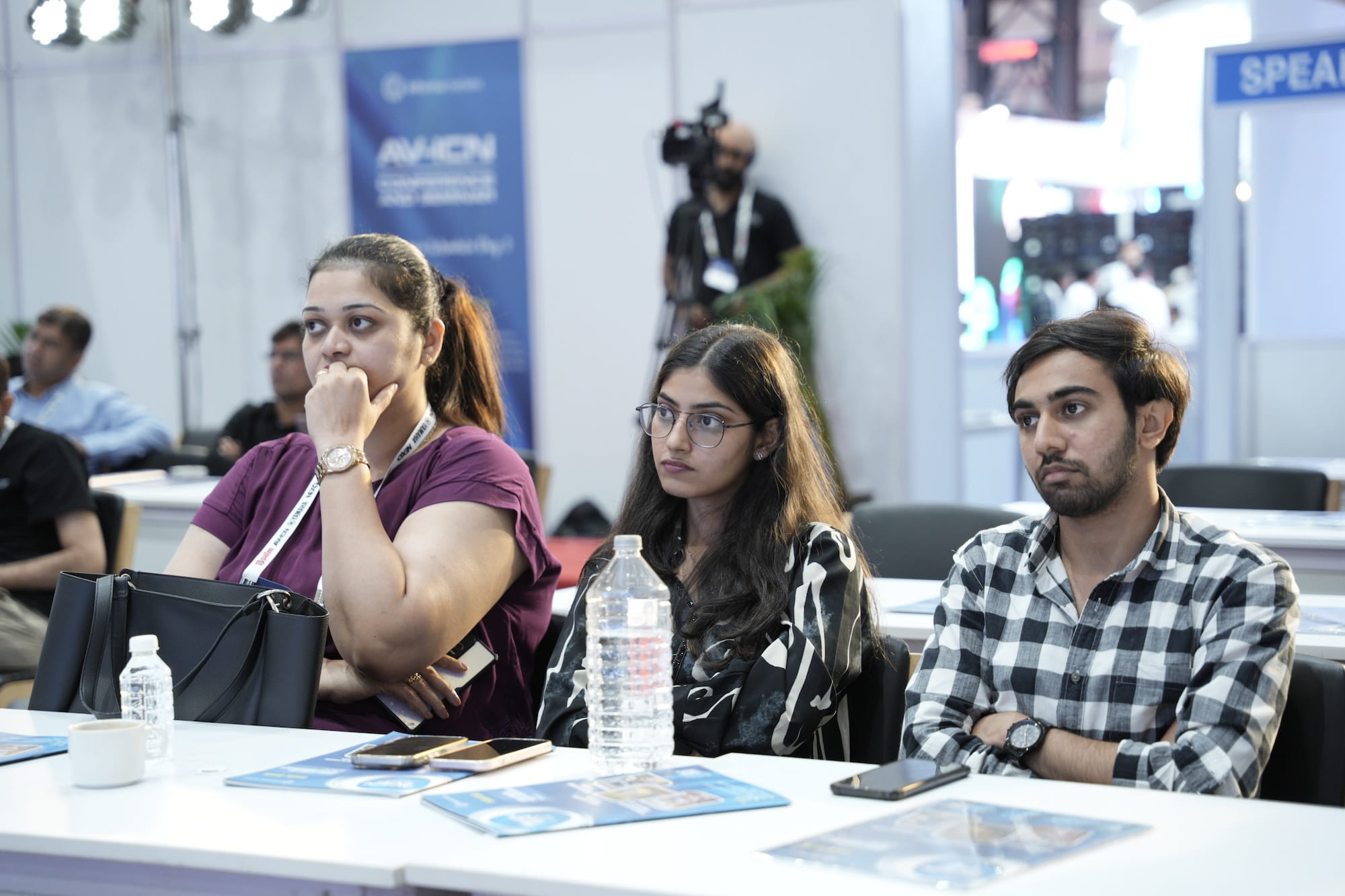 Attendees listening attentively at a conference or presentation.