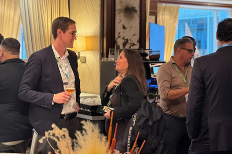 Delegates networking at evening beer bar reception during World Ethanol & Biofuels, connecting producers and industry leaders.