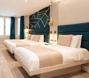 two double beds in hotel room