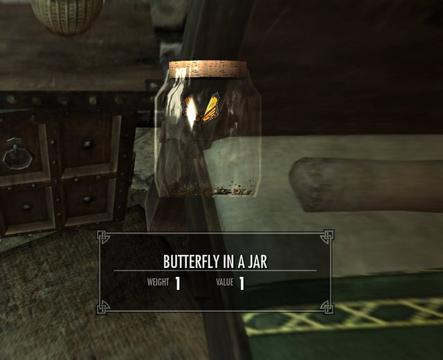 A butterfly trapped in a glass jar with 'Butterfly in a jar' written in a pop up