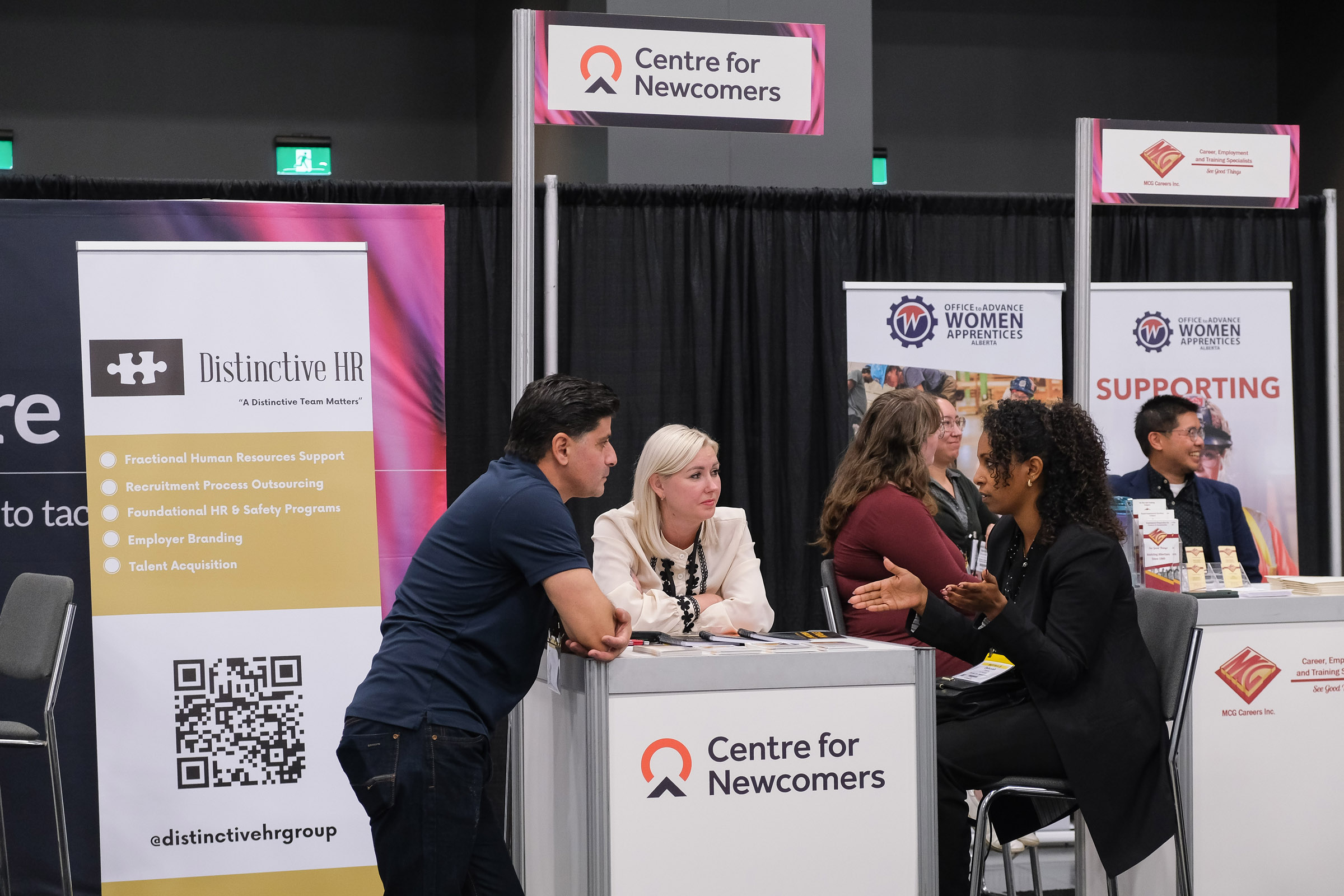 Closeup of the Workforce Solutions Centre tradeshow feature from BUILDEX Alberts showing a conversation.