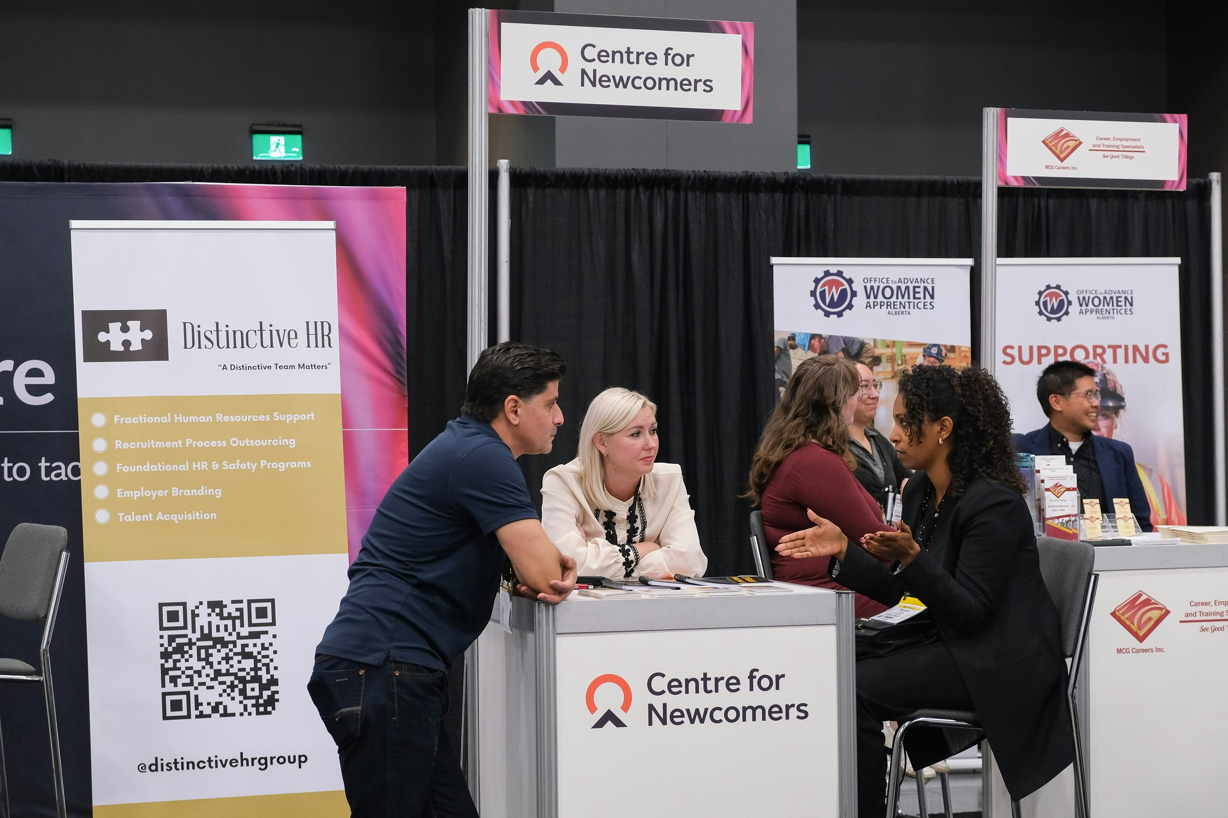 Closeup of the Workforce Solutions Centre tradeshow feature from BUILDEX Alberts showing a conversation.