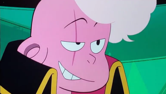 Lars smoulders at the camera. There is a long, pink scar over their left eye