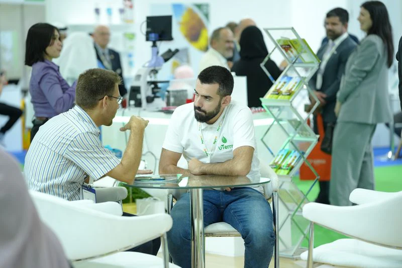Agriculture exhibitors meeting buyers at Growtech Middle East agricultural trade show in Dubai