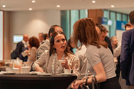 two women speaking in coffee break