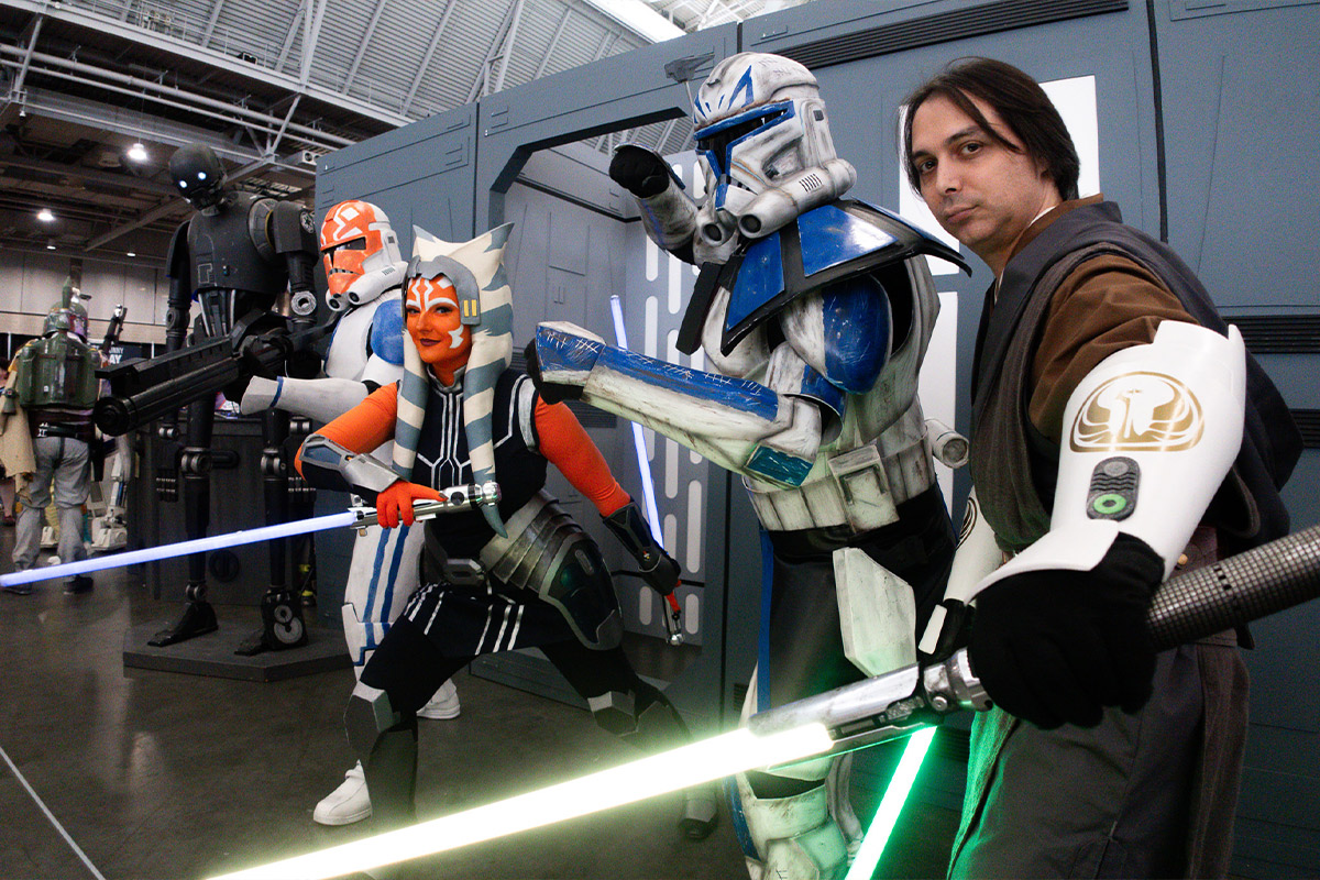 a group of star wars cosplayers pose for the camera