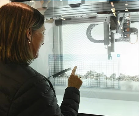 An expo attendee viewing product showcase on the show floor.