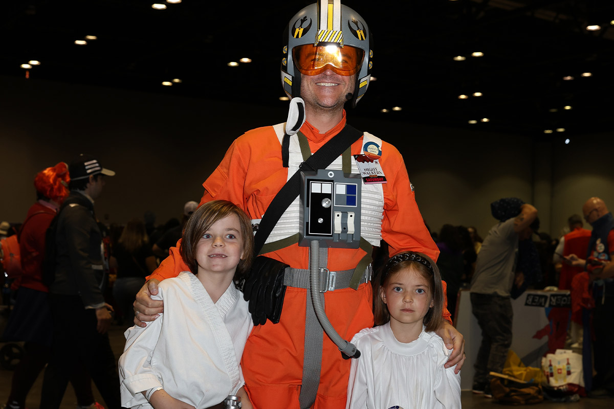 A father and his children dressed as Star Wars characters
