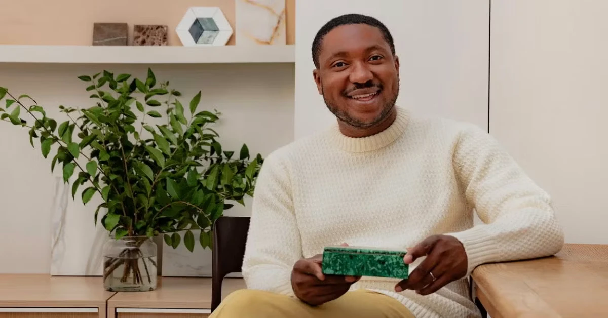 young black man in white jumper
