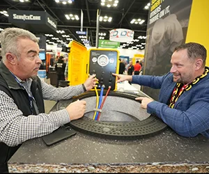 Two attendees networking on the expo floor
