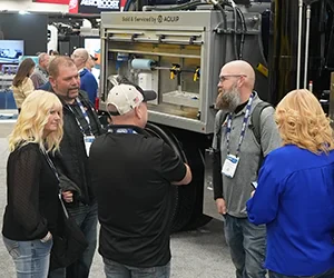 Group of attendees networking on the expo floor