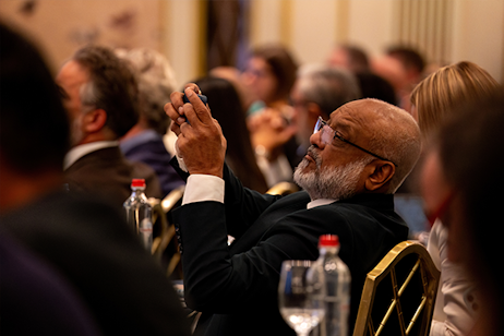 Attendee capturing a key presentation on specialty fertilisers and agritech advancements.