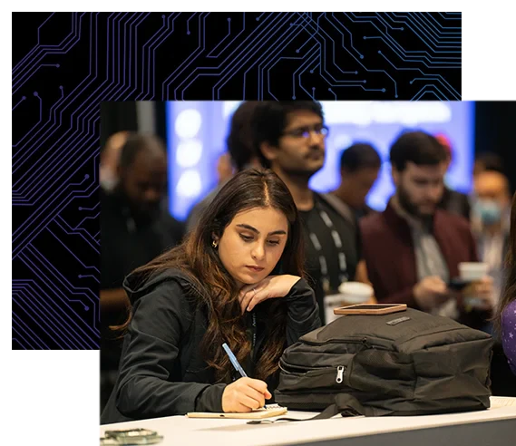 Attendee takes notes while listening to a speaker in the Chiphead Theater.