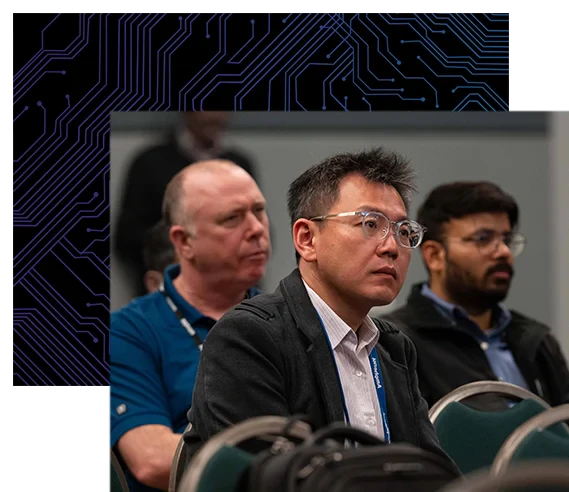 DesignCon conference attendee listens intently to conference speaker