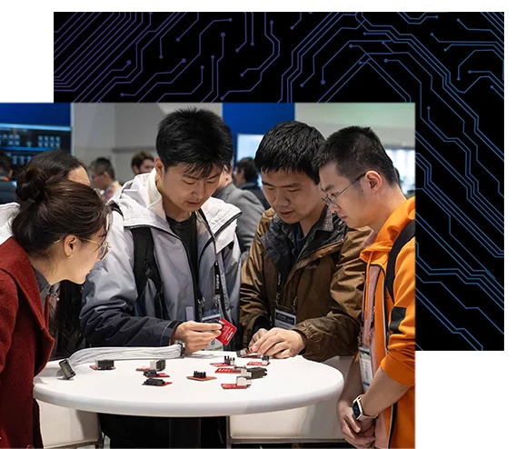 4 attendees inspect semiconductor chips at DesignCon