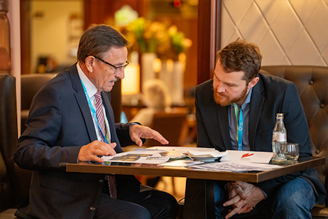 Two delegates in discussion during World Ethanol & Biofuels 2025 in Brussels, connecting global ethanol producers and policymakers.
