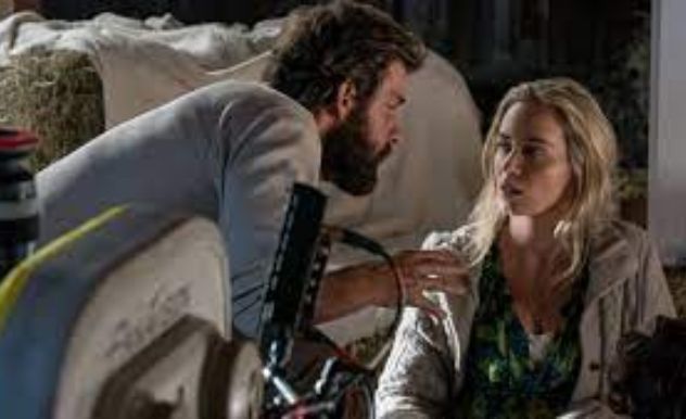 John krasinski and emily blunt doing a scene from the quiet place