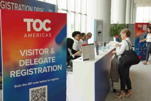 Visitors checking in at the TOC Americas registration desk.