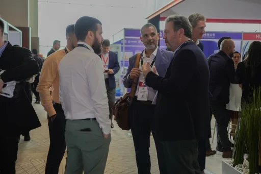 Participants discussing business at an event networking area.