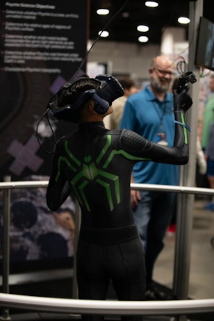 A fan plays with the NASA technology that the organization brought to help fans explore a virtual space experience