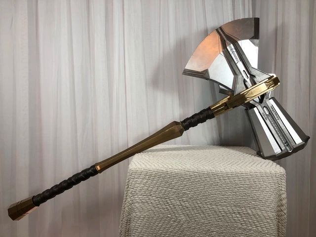 Storm breaker perched on a beige ottoman - clearly shined and awaiting a worthy Taurus