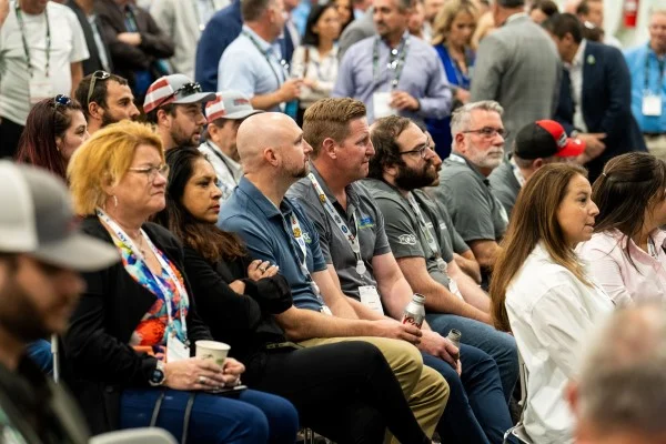 Group of attendees sitting down at the EREF Auction