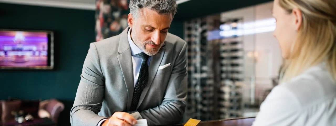 Hotel guest at the hotel reception desk
