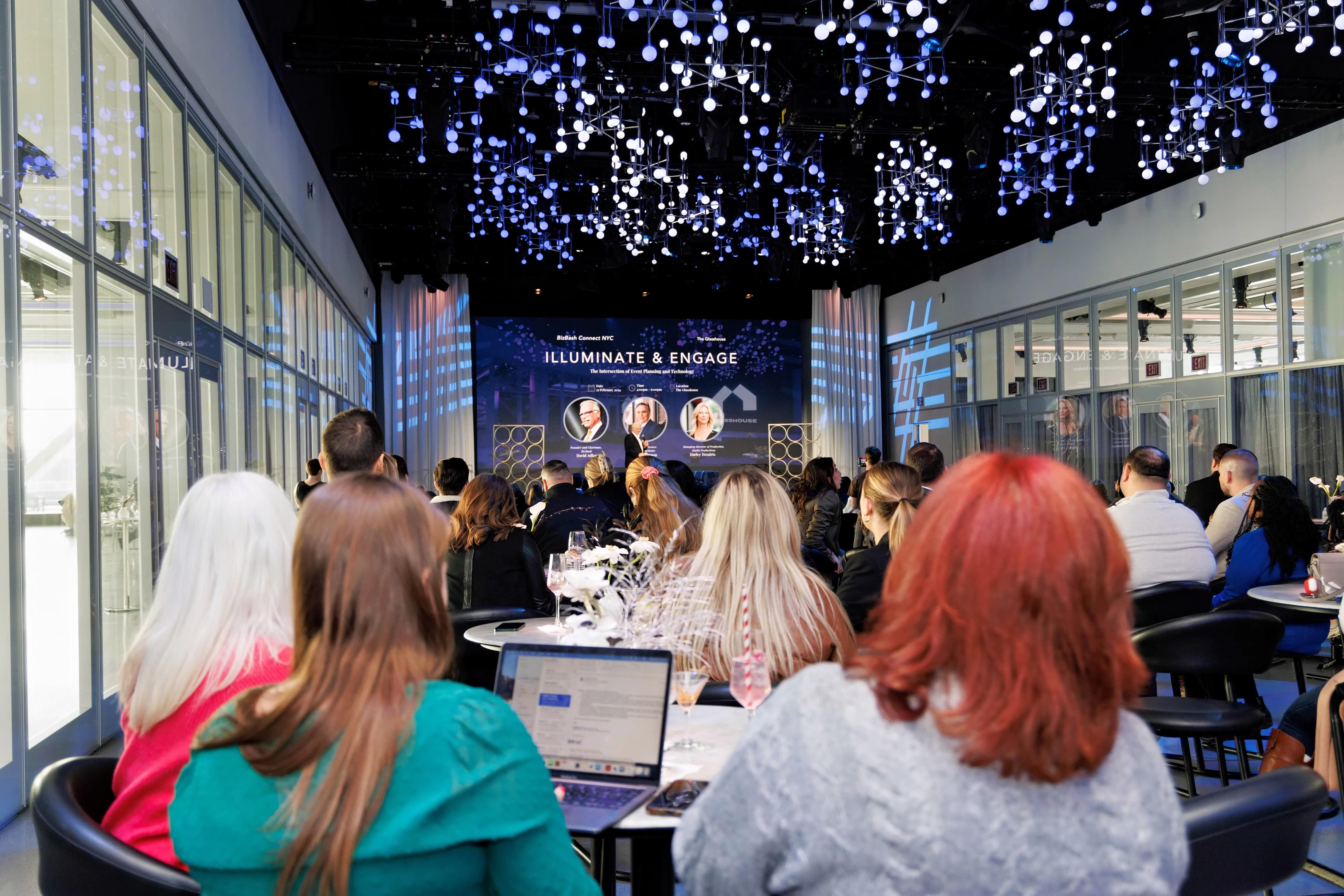 Large audience intently listening to an education session at a cutting-edge venue in New York City