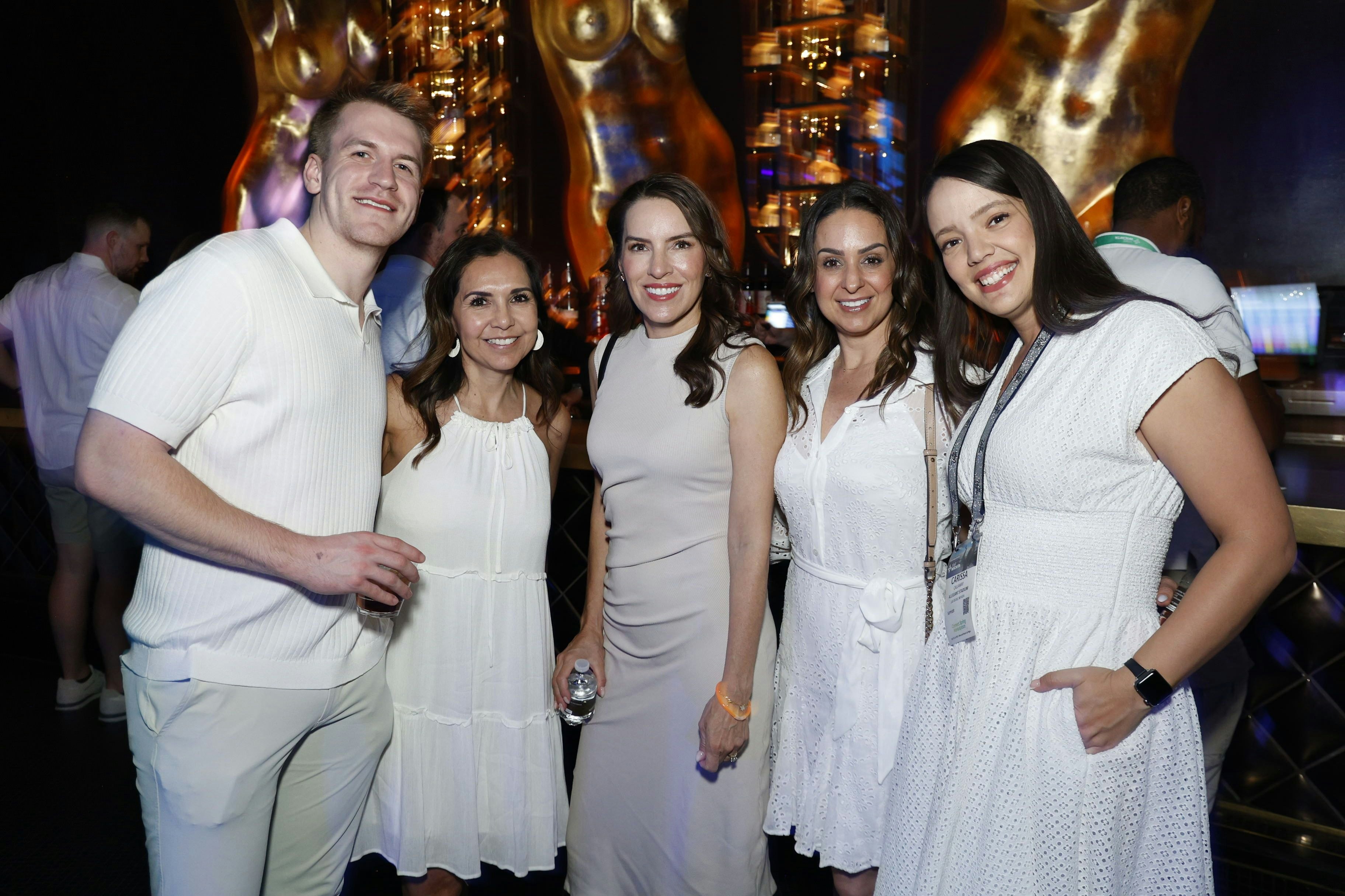Large group of event professionals smiling for a photo at the Connect White Party.