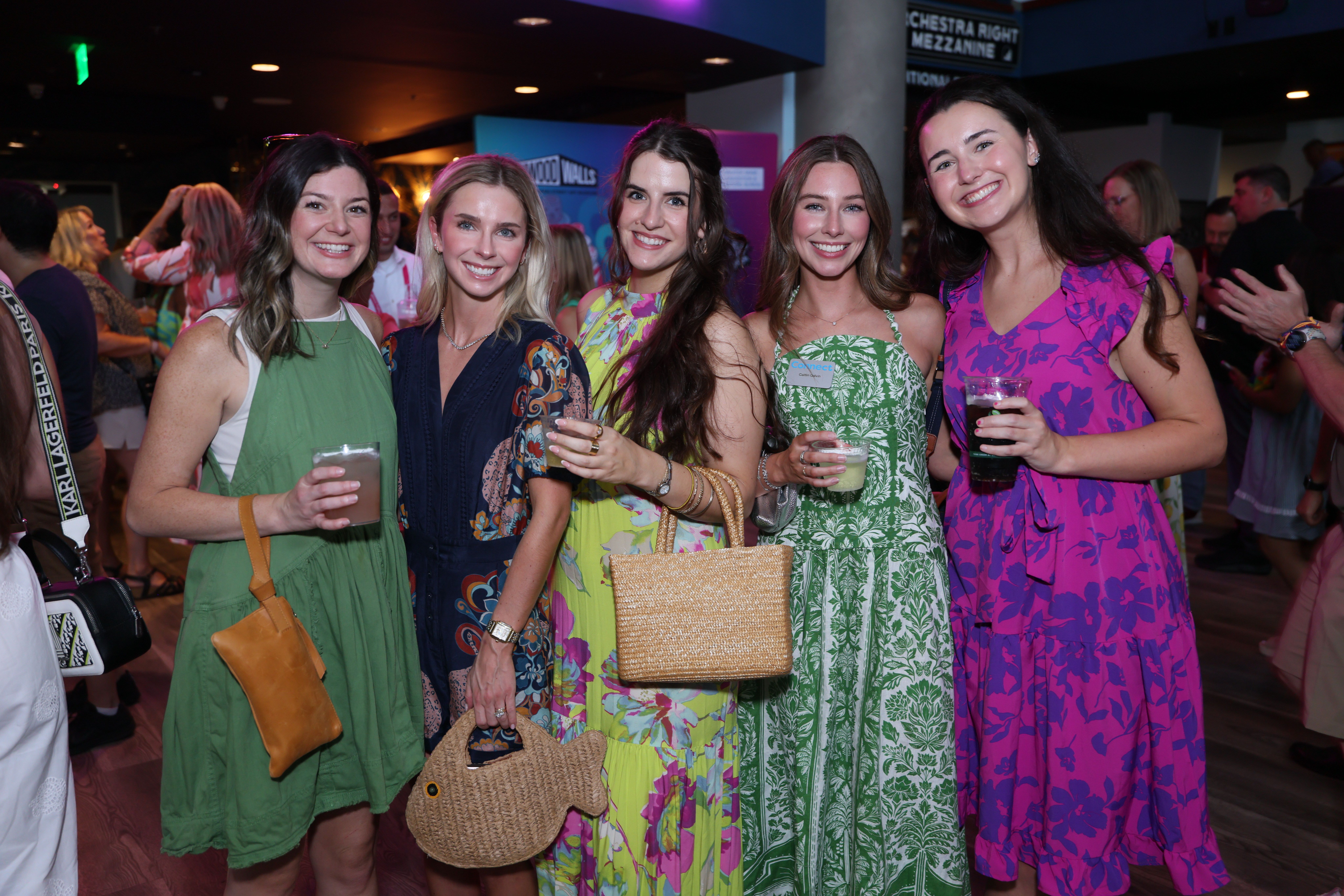 Group of attendees making silly faces at camera