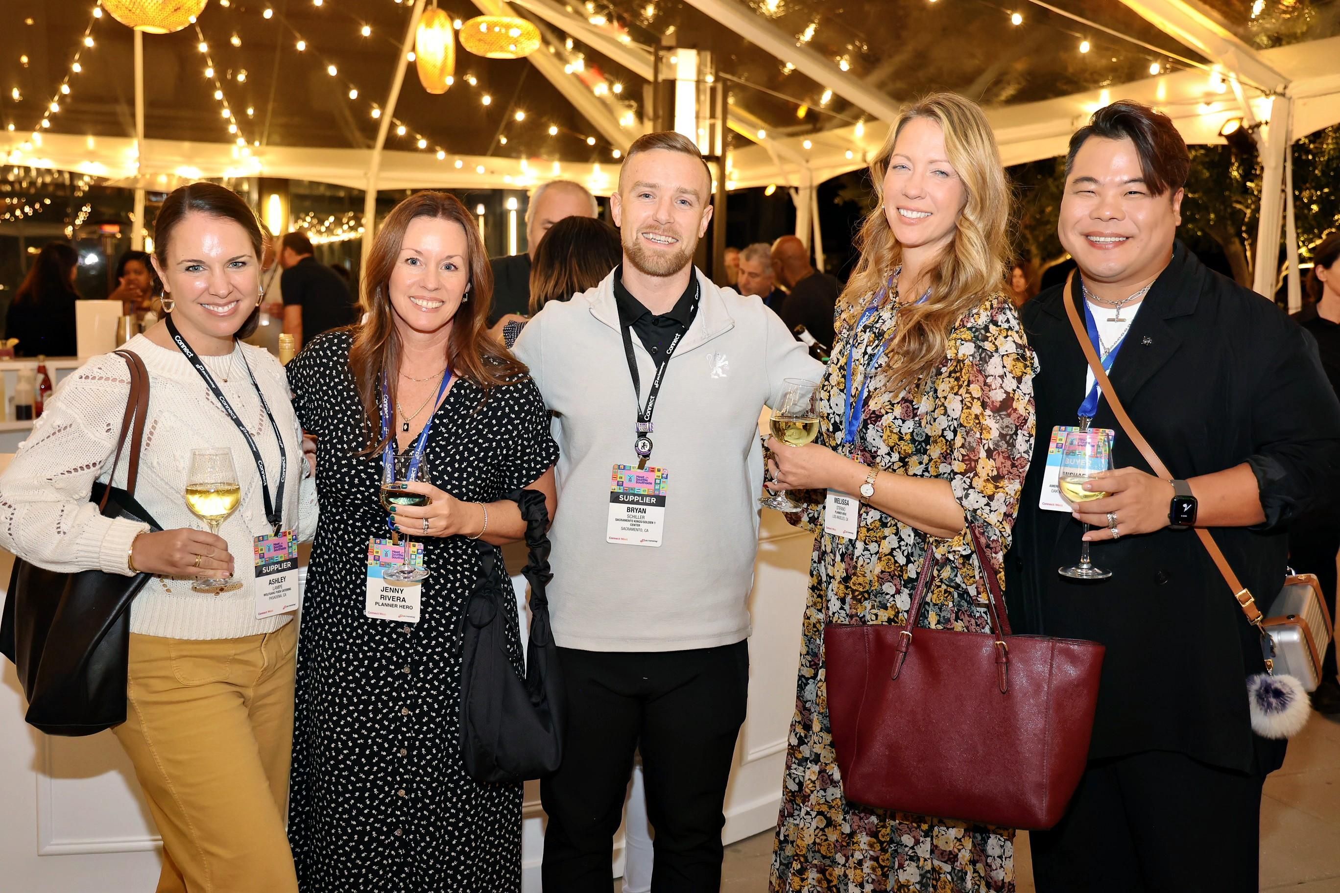 A group of event professionals at an opening reception at Connect West 2024.