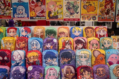 A selection of body pillows and art, all in a soft featured animation style. The rainbow colours showcase a wide array of characters from live action, animation, anime, and more