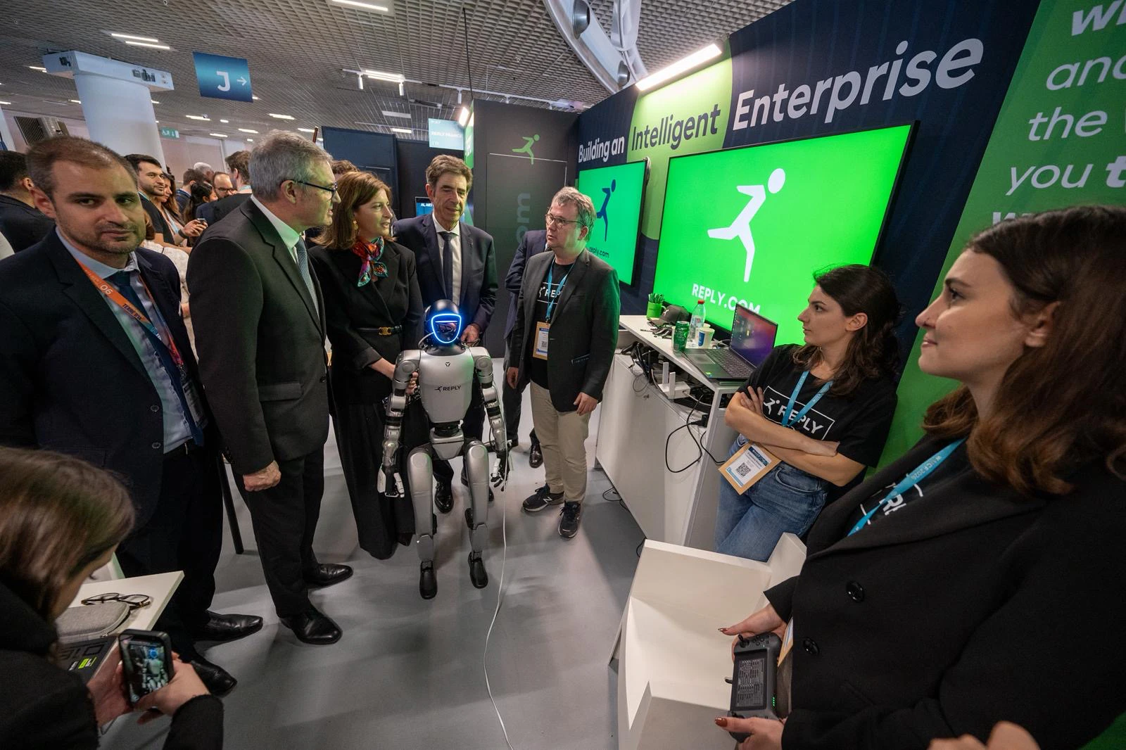 Attendees enjoy experiencing AI along a trail at WAICF 2026