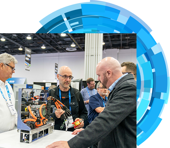 Four bussines men engaged in conversation at a bustling trade show event