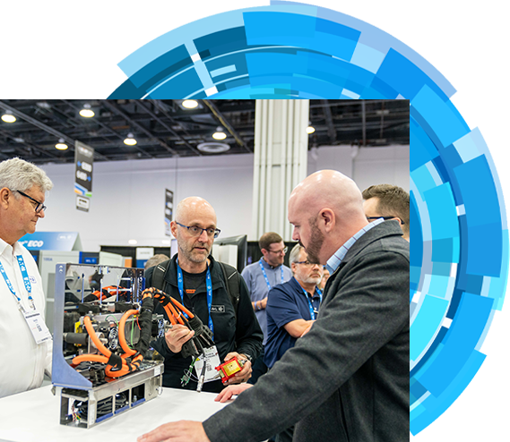 Four bussines men engaged in conversation at a bustling trade show event
