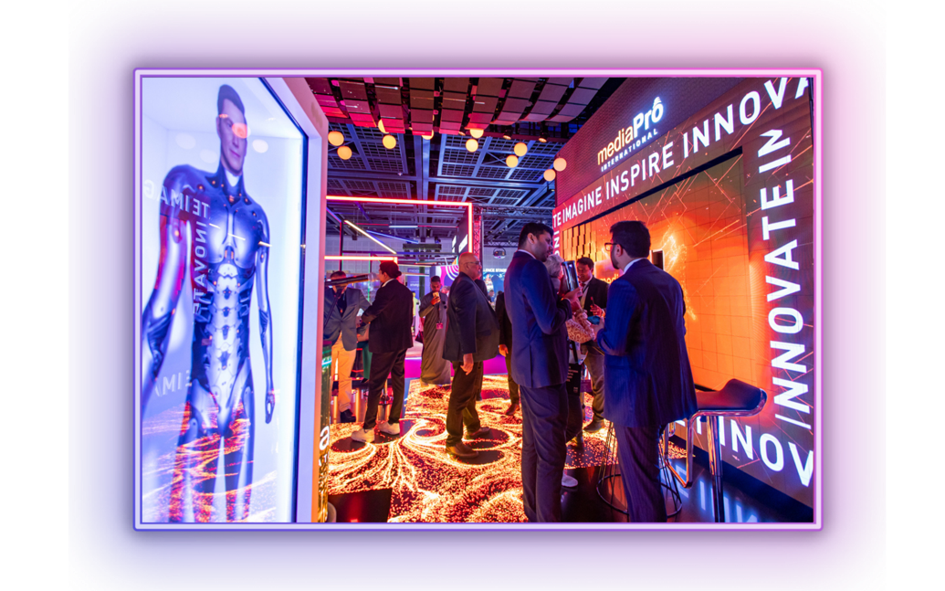 Attendees networking at MEES exhibition floor surrounded by event tech booths and activation spaces