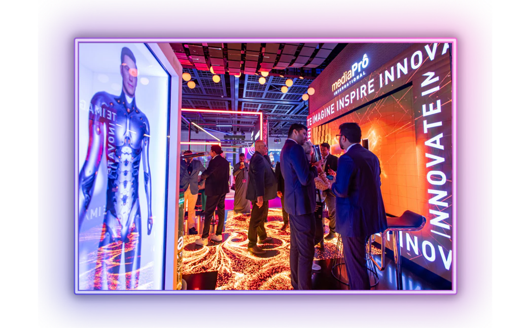 Delegates networking at MEES exhibition floor surrounded by event tech booths and activation spaces