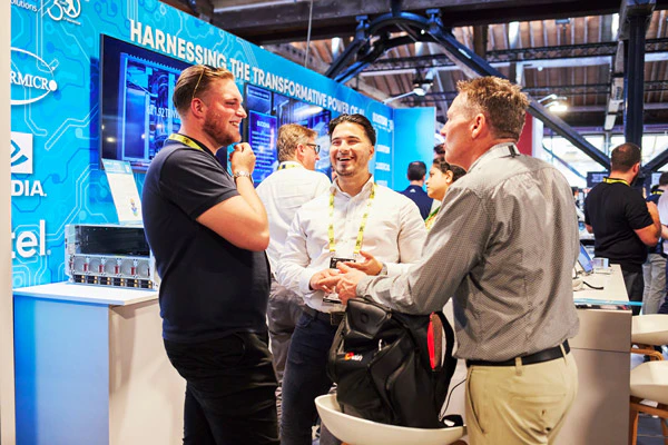 Men explore The AI Summit London Expo floor