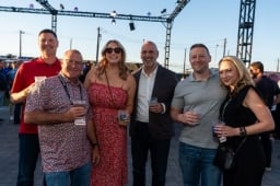 Group of 6 posing for a photo at the WasteExpo Welcome Reception