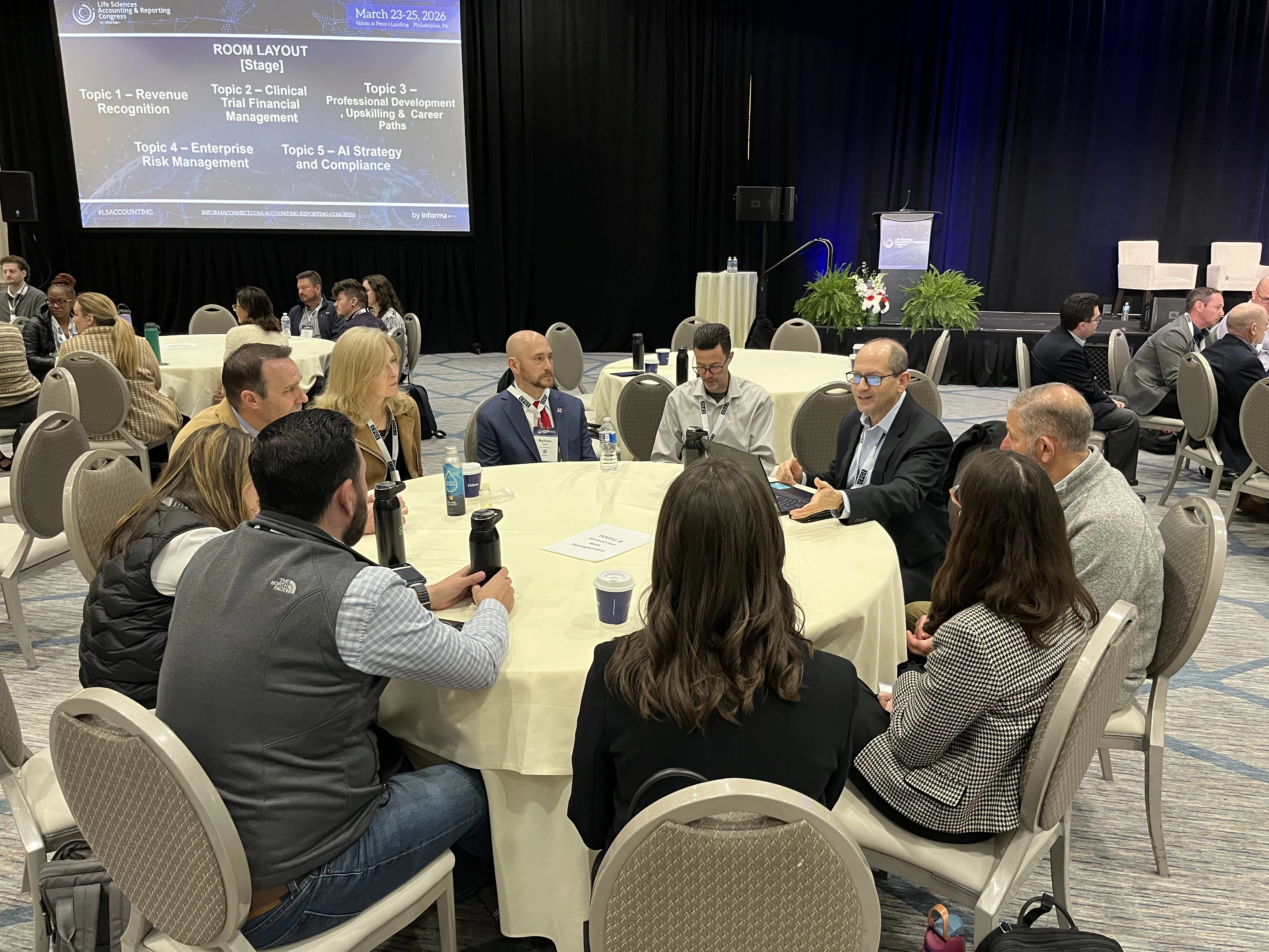Professionals participating in roundtable discussion on key life sciences finance and accounting challenges shaping the industry