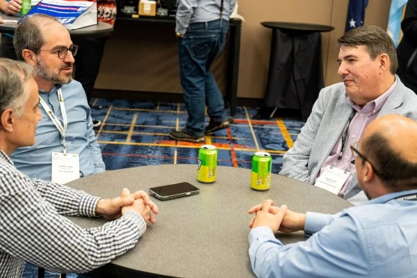 Group having a conversation at international reception