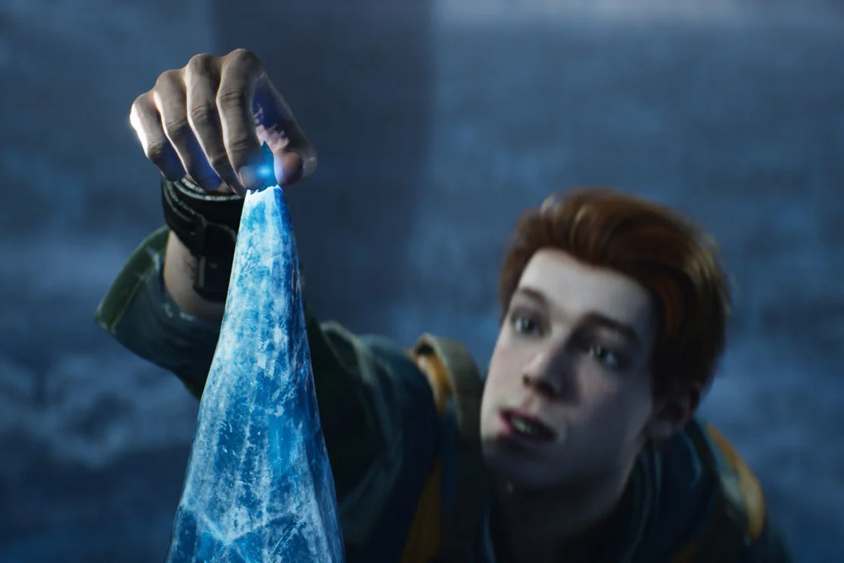 Cal Kestis reaches up to the tip of an ice pillar to pick off a fresh Kyber crystal