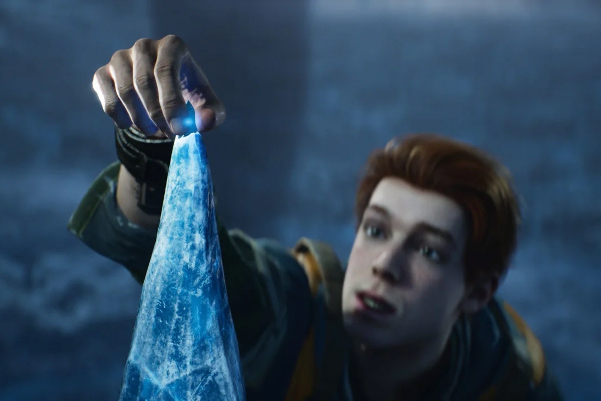 Cal Kestis reaches up to the tip of an ice pillar to pick off a fresh Kyber crystal
