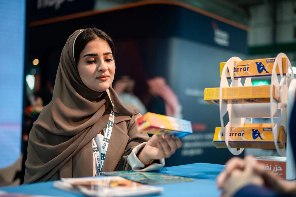Attendee inspecting exhibits