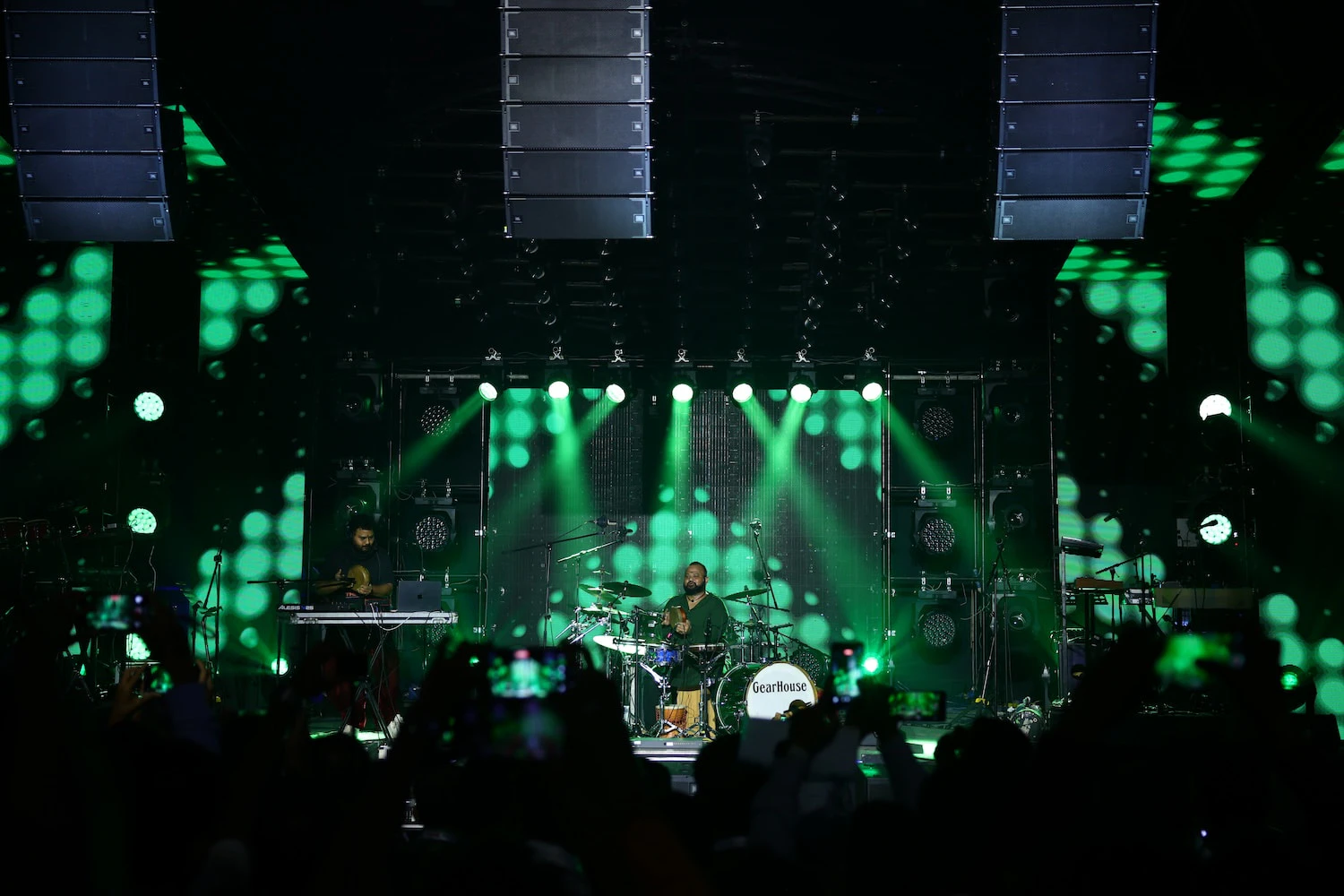 Two percussionists performing live on the Harman Live Arena stage at PALM Expo