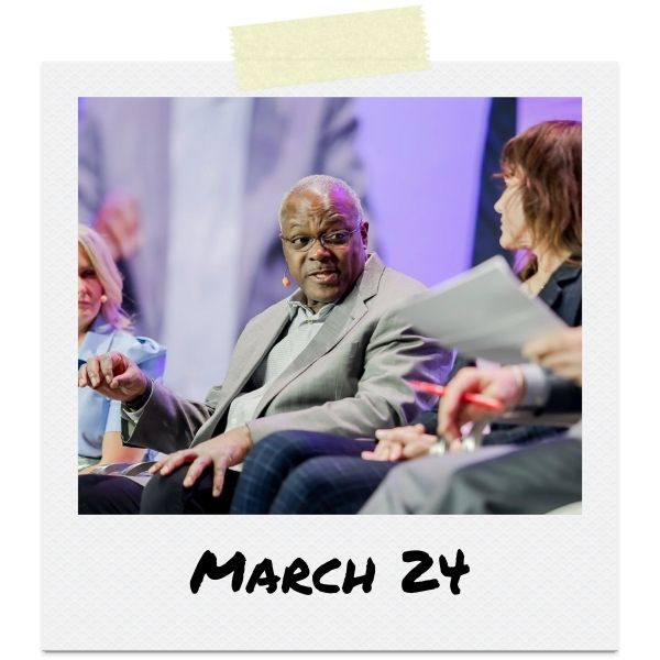A photo of a man speaking onstage. Text below the photo says "March 24"