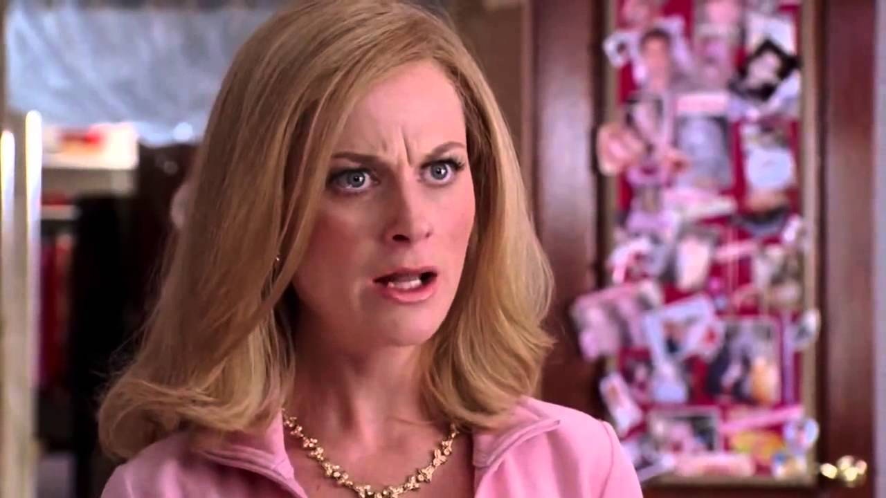 Mrs. George from Mean Girls mid-conversation in a pink outfit