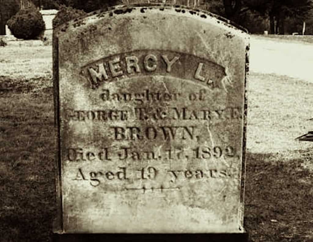 A gravestone with the name 'Mercy L' written in curved letters