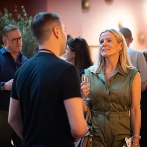 blond woman talking to a young man